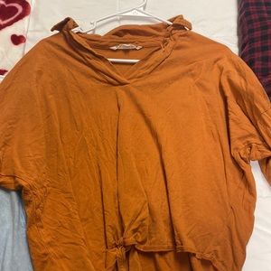 Orange long sleeve with collar and tie at the front